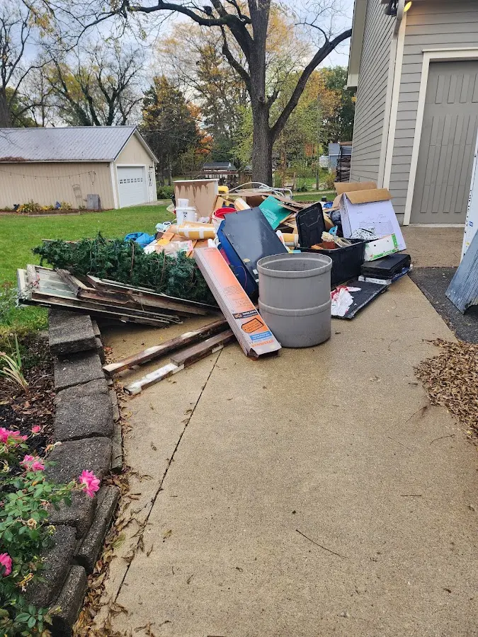Dumpster being loaded with debris for Commercial Dumpster Rental in West Bridgewater